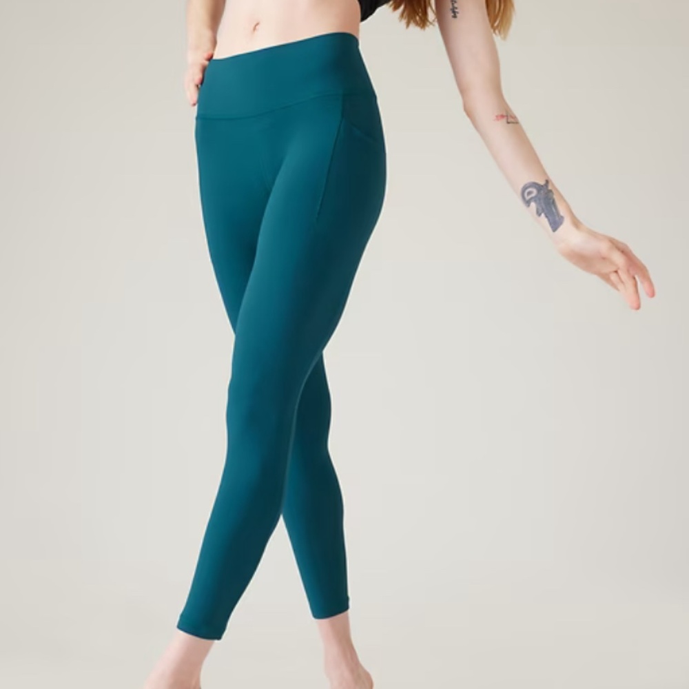 Athleta Mid Rise Salutation Stash Tight - TEAL